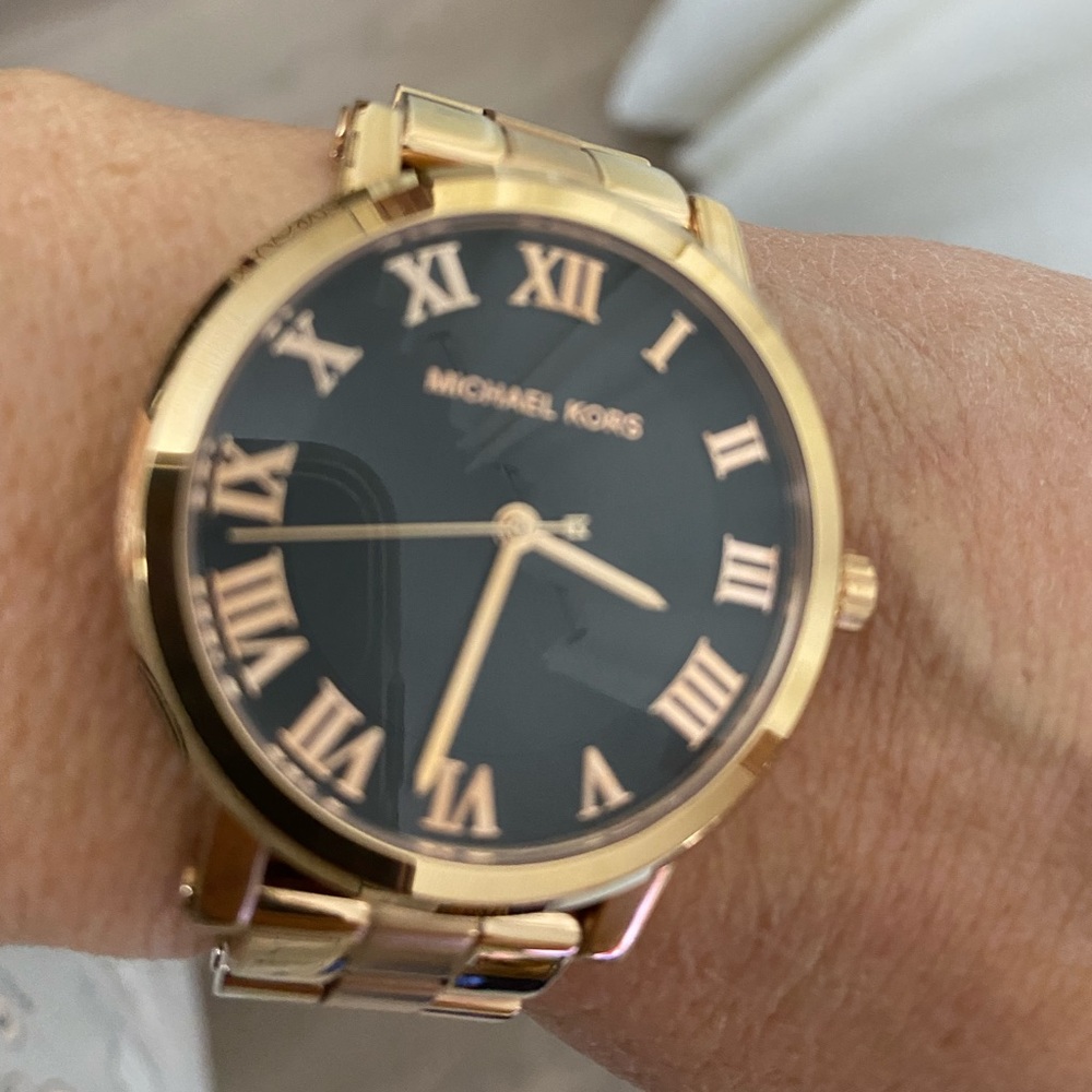 Rose gold and black bezel watch
